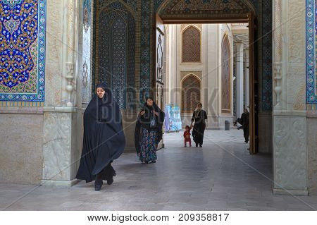 Fars Province Shiraz Iran - 19 april 2017: Shah Cheragh Shrine Islamic women pass through the large gate of the mosque.