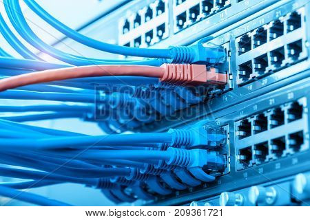 Network cables in switch and firewall in cloud computing data center server rack
