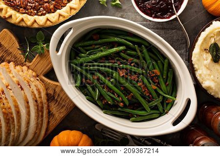 Green beans with bacon, side dish for Thanksgiving or Christmas dinner overhead shot