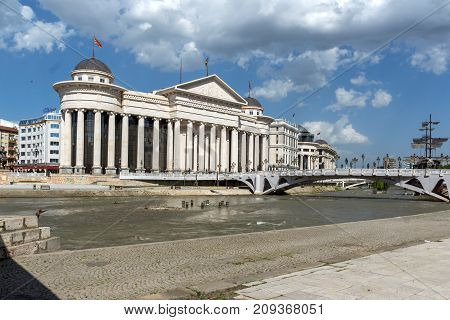 SKOPJE, REPUBLIC OF MACEDONIA - 13 MAY 2017: Skopje City Center - Archaeological Museum and Bridge over Vardar River, Republic of Macedonia