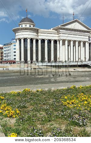 SKOPJE, REPUBLIC OF MACEDONIA - 13 MAY 2017: Skopje City Center - Archaeological Museum and Bridge over Vardar River, Republic of Macedonia