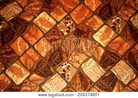 Decorative wall with rectangel stones. brown texture