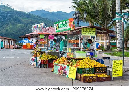SALENTO COLOMBIA - JUNE 6: Stands selling juice in the plaza in Salento Colombia on June 6 2016