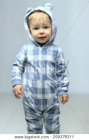 People, children, childhood concept - Cute little baby boy standing.