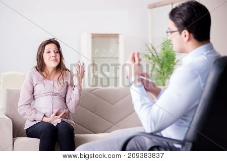Pregnant woman visiting psychologist doctor