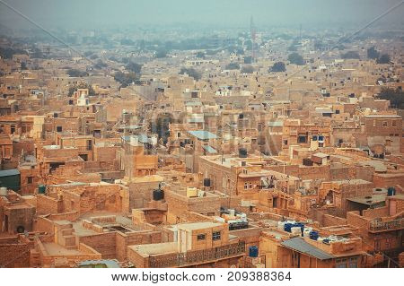 Aerial view on city streets and stone houses at eveninf fog. Jaisalmer of Rajasthan lies in the heart of the Thar Desert