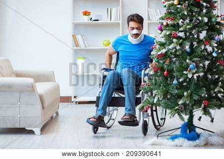 Injured disabled man celebrating christmas at home