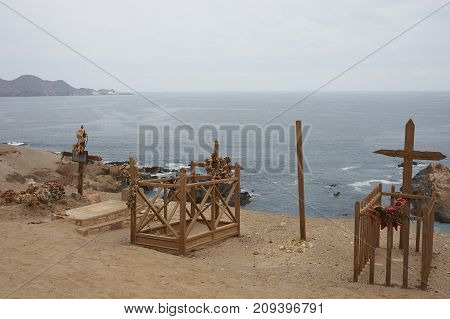 Pisagua, Tarapaca Region, Chile - August 30, 2017: Historic cemetery from the era of nitrate mining in the Atacama Desert, at Pisagua on the coast of northern Chile