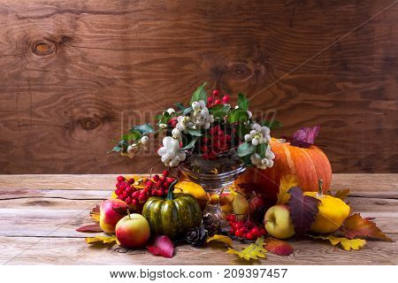 Thanksgiving Centerpiece With Snowberry And Rowan Berries In Glass Vase, Copy Space