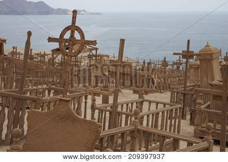 Pisagua, Tarapaca Region, Chile - August 30, 2017: Historic cemetery from the era of nitrate mining in the Atacama Desert, at Pisagua on the coast of northern Chile