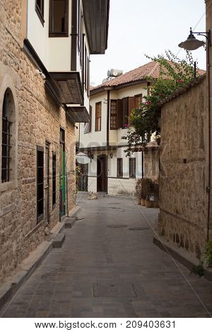 Vertical shot of narrow streets with Osmanish style mansions in Antalya, Turkey