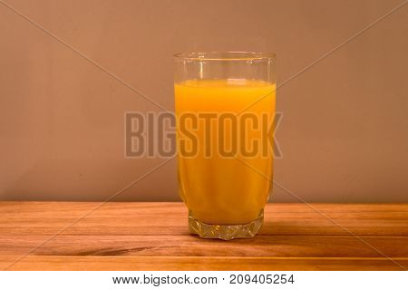 long tall glass of healthy orange juice