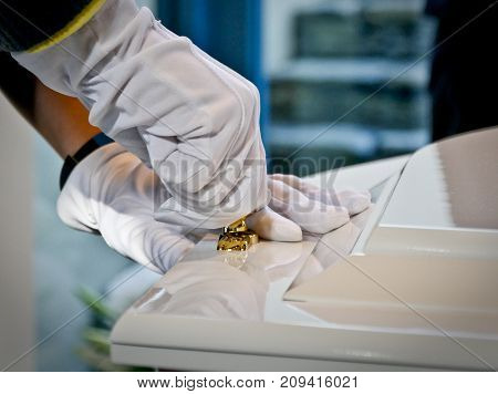 closeup shot of a colorful casket in a hearse or chapel before funeral or burial at cemetery