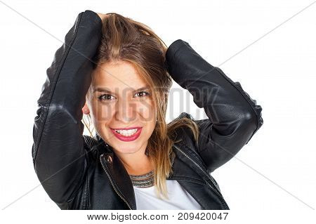 Attractive young woman with sensual look posing on isolated wearing black leather jacket