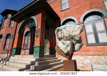 December 9, 2015 Bisbee Arizona USA: a large mineral displayed at the entrance of the Bisbee Mining & Historical Museum once the corporate headquarters of a copper mining company