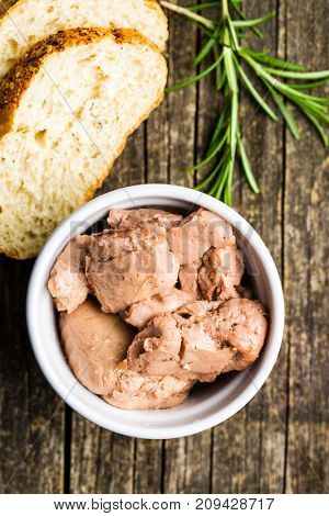 Cod liver in oil in bowl.