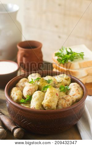 Cabbage Rolls Served With Sour Cream, Bread And Wine. Dolma, Sarma, Sarmale, Golubtsy Or Golabki.
