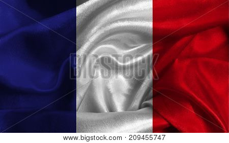 Realistic flag of France on the wavy surface of fabric. This flag can be used in design.