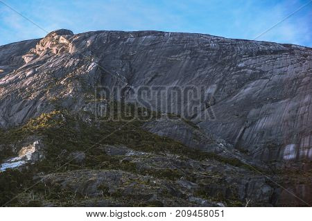 Peaks of the majestic Mountain Kinabalu & forest with blue sky in Mountain Kinabalu,Sabah,Malaysia.