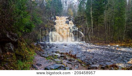 Falls in park in the Karelia, in clear summer day