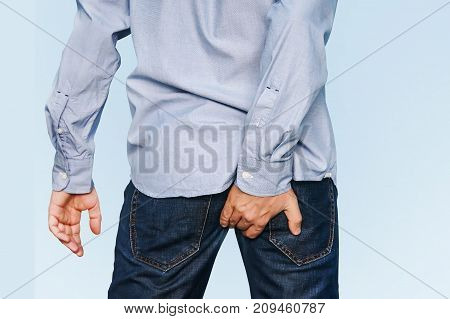 Man Has Diarrhea Holding His Butt.