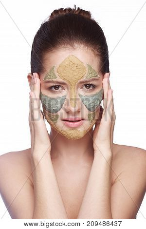 portrait of a girl with a cosmetic mask on her face