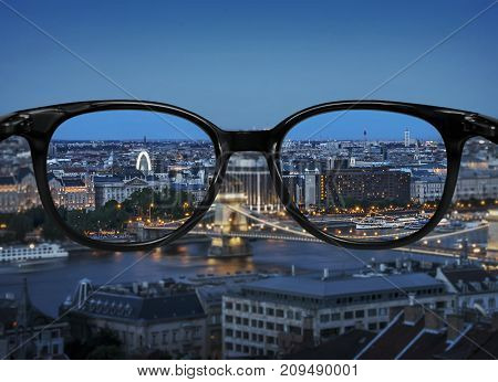 Clear Vision Through Glasses Over Night City Landscape