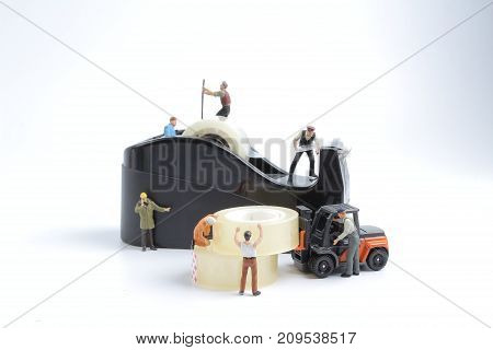 Mini Of Worker Replace The Tape For Dispenser