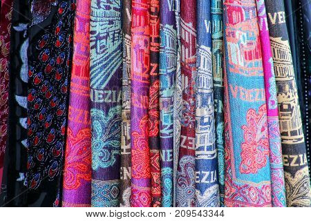 Display of texile at a souvenir shop in the street of Venice Italy. Venice is one of the most important tourist destinations in the world for its celebrated art and architecture