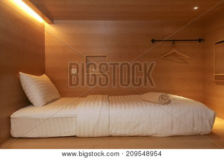 Bed In Small Simple Hotel Bedroom