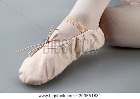 Close up of a ballet slippers. Legs in ballet slippers.