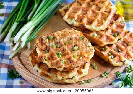 Waffles with cheese and onions on the table