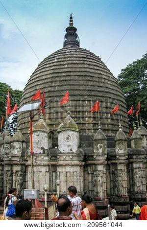 GUWAHATI ASSAM INDIA - JULY 4 2014 : Hindu devotees que at Kamakhya Temple or Kamrup-Kamakhya temple dedicated to the mother goddess Kamakhya. It is famous Hindu religious destination.