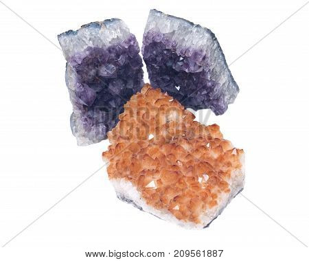 Citrine druzy cluster surrounded by amethyst druzy clusters  isolated on white background