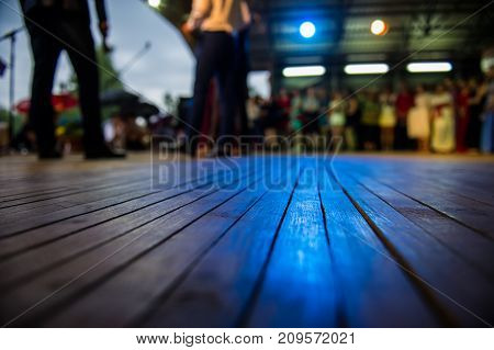 lurred silhouettes of people and dance floor in an open area