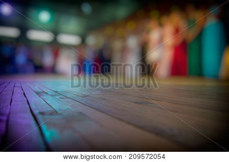 lurred silhouettes of people and dance floor in an open area