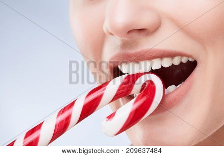Red And White Candy In A Mouth