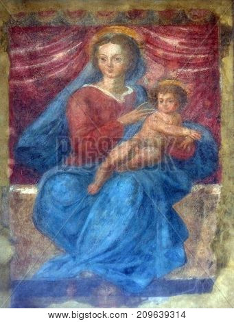 LUCCA, ITALY - JUNE 03: Porta San Gervasio, the inner lunette decorated by a Madonna with Child, Lucca, Tuscany, Italy on June 03, 2017.