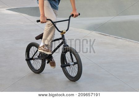 Extreme cyclist trains in special sport playgorund outdoor noface
