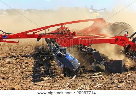 Agricultural Machinery For The Fields. Rattot Plow Field. The Farmer In The Tractors Is Preparing Th