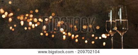 Solemn background with golden lights and champagne for new year congratulations