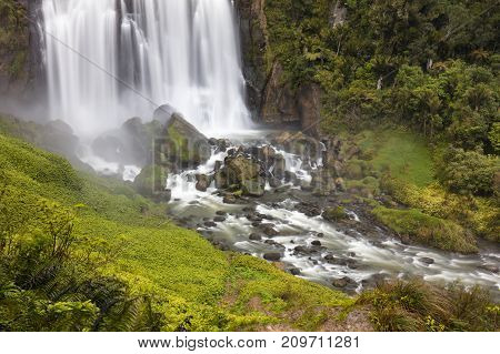 Marokopa Falls near Waitomo with heavy flow of water after winter storms.
