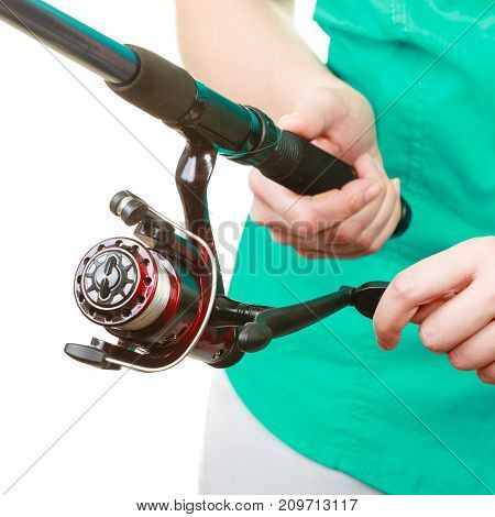 Person Holding Fishing Rod, Spinning Equipment.