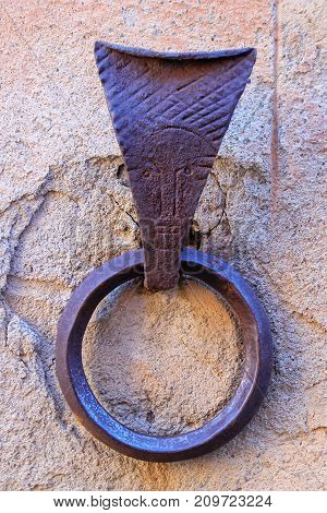 Metal ring to tie horses in Montalcino town Val d'Orcia Tuscany Italy. Such rings are a common feature of medieval architecture in Tuscany.