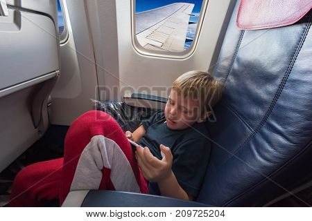 In The Cabin Of The Plane The Boy
