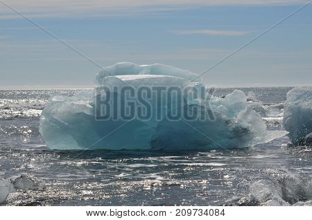 Breathtaking view of a iceberg in the frigid waters in Iceland