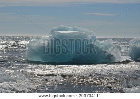 Breathtaking View Of An Iceberg In The Waters In Iceland