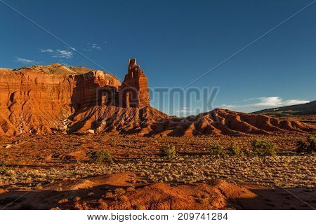 Magnificent sunset view of iconic Chimney Rock at Capitol Reef National Park in Utah.