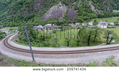 Brusio Switzerland - May 2017: Circular viaduct bridge near Brusio on the Swiss Alps
