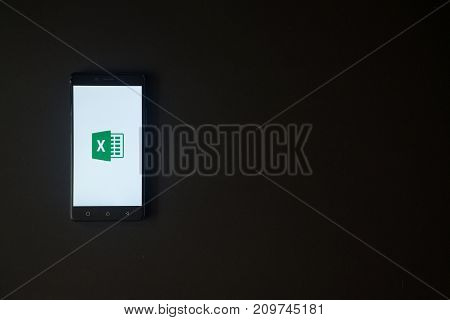 Los Angeles, USA, october 19, 2017: Microsoft office excel logo on smartphone screen on black background.